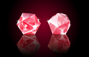 Two red rubin diamonds, lying on black mirrored background