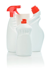 three white bottle with red cover and towel