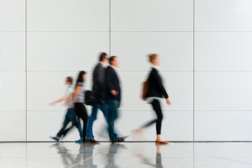 indoor walkway with blurred people