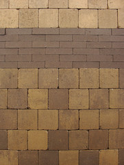 brown yellow pavement made with rectangular and sqaure stones