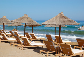 Sunbeds at the beach of luxury hotel, Crete, Greece