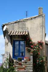 Fototapeta na wymiar Rustic house with a blue door