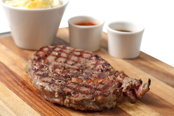 roasted meat on a cutting board. isolated on a white background