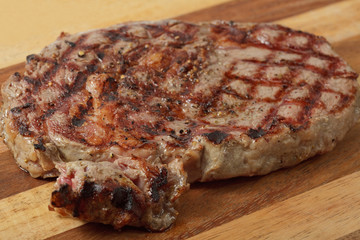 roasted meat on a cutting board. isolated on a white background