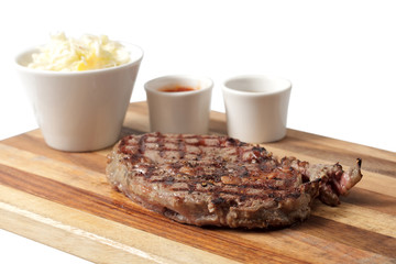 roasted meat on a cutting board. isolated on a white background