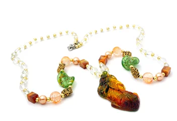 Fotobehang Xian bracelet with color gems isolated on a white background  © birdmanphoto