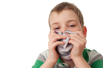 chilled boy wipes scarf nose isolated on white