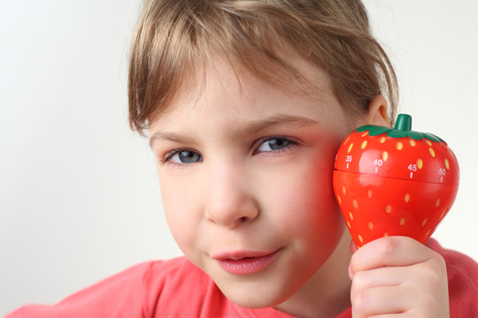 Little  Girl In Red Shirt Holding In Hand Plastic Kitchen Timer