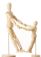 wooden figures of parent and child holding for hands, full body,