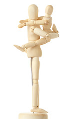 wooden figures of child embracing his parent by shoulders