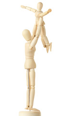 wooden figures of parent carring his child over his head,