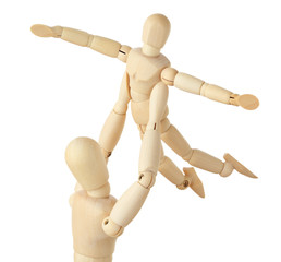 wooden figures of parent carring his child over his head