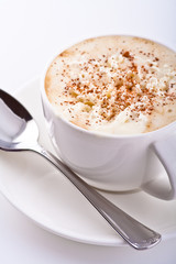 mug of coffee with whipped cream and cinnamon