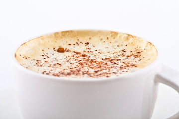 mug of coffee with whipped cream and cinnamon