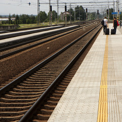 Fototapeta na wymiar People on a railroad platform