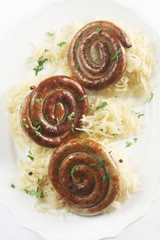 Obraz na płótnie Canvas German Cuisine: Spiral-Shaped Bratwursts