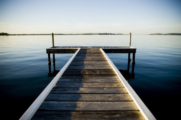 Fototapeta premium Sunrise view from a pier or jetty on Lake Macquarie in New South Wales, Australia