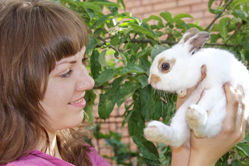 young girl with a rabbit