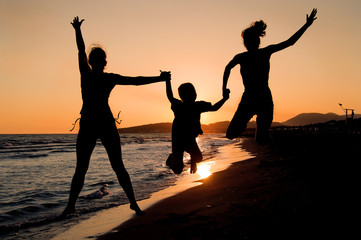 Family silhouette on the beach
