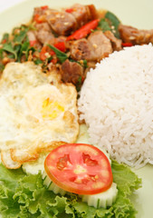 Spicy Thai food, crunchy pork with hot basil and guinea pepper