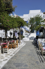 Tavernas & whitewashed buildings in Mykonos Town Greece.