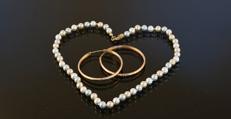 Beads in the shape of a heart with two rings