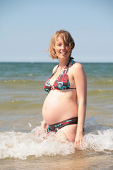 Pregnant woman enjoying her summer