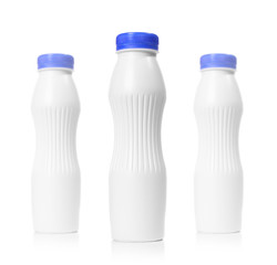 Three blank plastic bottles isolated on white. Depth of field ef