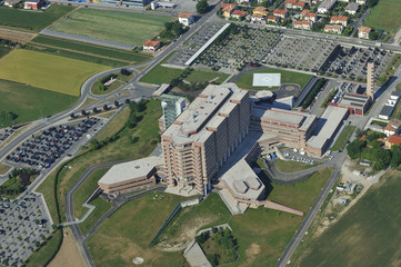 Fototapeta na wymiar Hospital building with helipad in the city and skyscraper