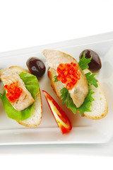 salmon chunks and caviar on baguette