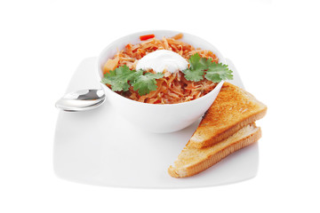 red vegetable soup in white bowl