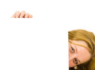 Portrait of a beautiful blond woman holding a blank billboard