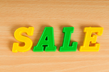 The word sale made of plastic letters