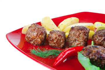 roast cutlets on red dish
