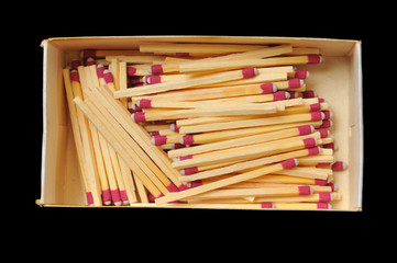 Matches in a box isolated on black