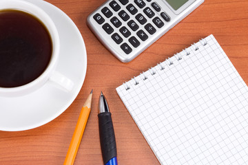 coffee and pens on table