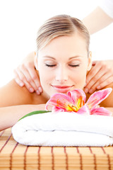 Obraz na płótnie Canvas Relaxed bright woman enjoying a back massage