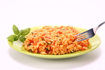 Risotto with tomatoes being eaten with a fork