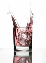 Beautiful splash of ice in a glass