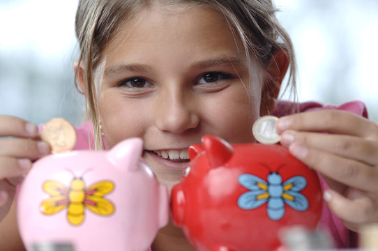 School girl and piggy bank