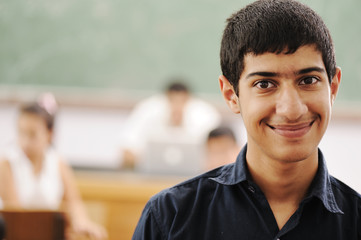 Young student in classroom in college