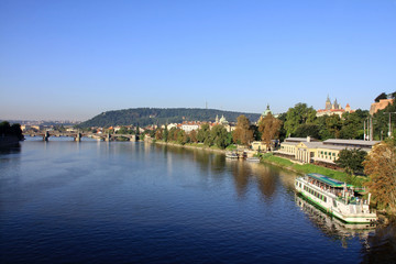 Fototapeta na wymiar The View on summer Prague above River Vltava with gothic Castle