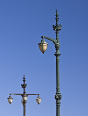Fototapeta na wymiar Antique street lamp against a blue sky
