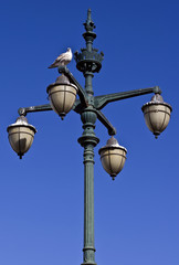Fototapeta na wymiar Antique street lamp against a blue sky
