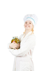 cook girl  holding  tin of pickled  cucumbers