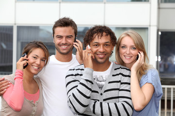 Group of friends with telephone