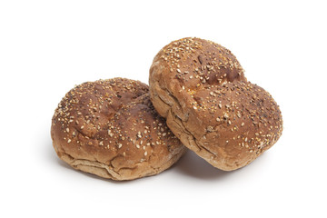 Fresh multi-grain rolls on white background