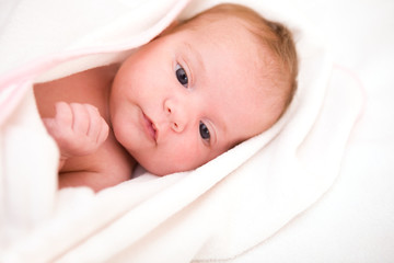baby after bath in towel