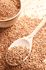 buckwheat in wooden spoon