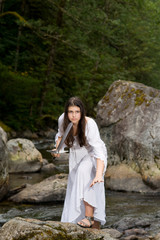 Young girl in white dress with two handed sword
